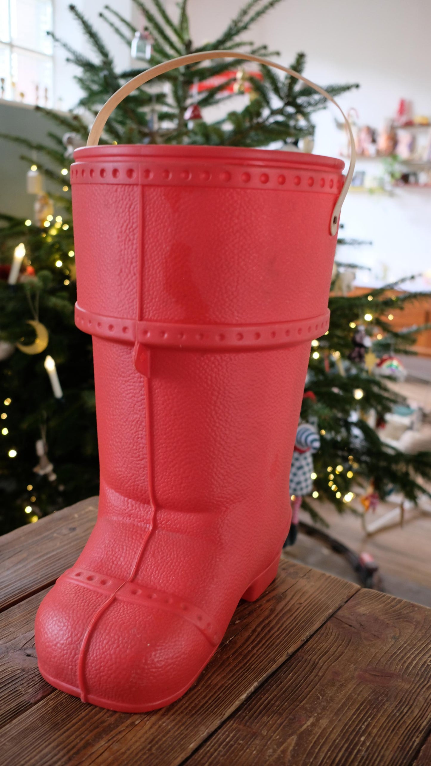 Baril de lessive en forme de botte du père noël