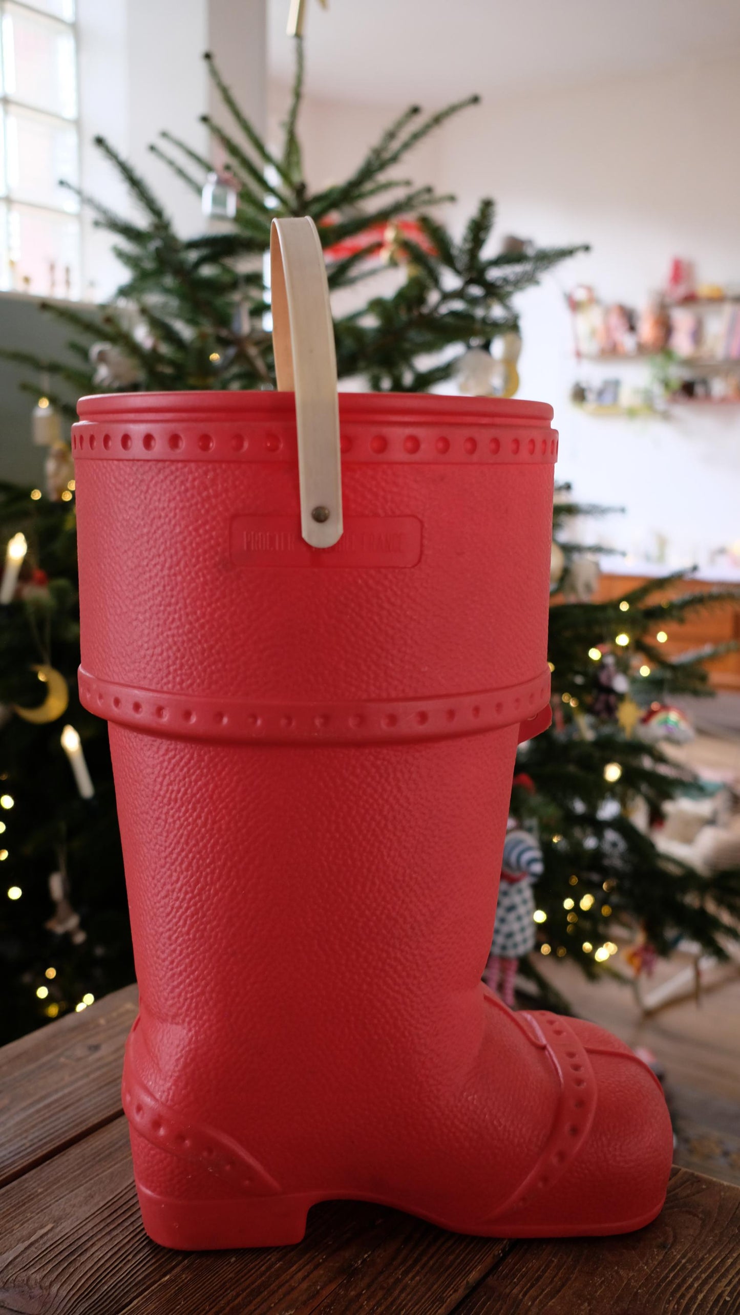 Baril de lessive en forme de botte du père noël