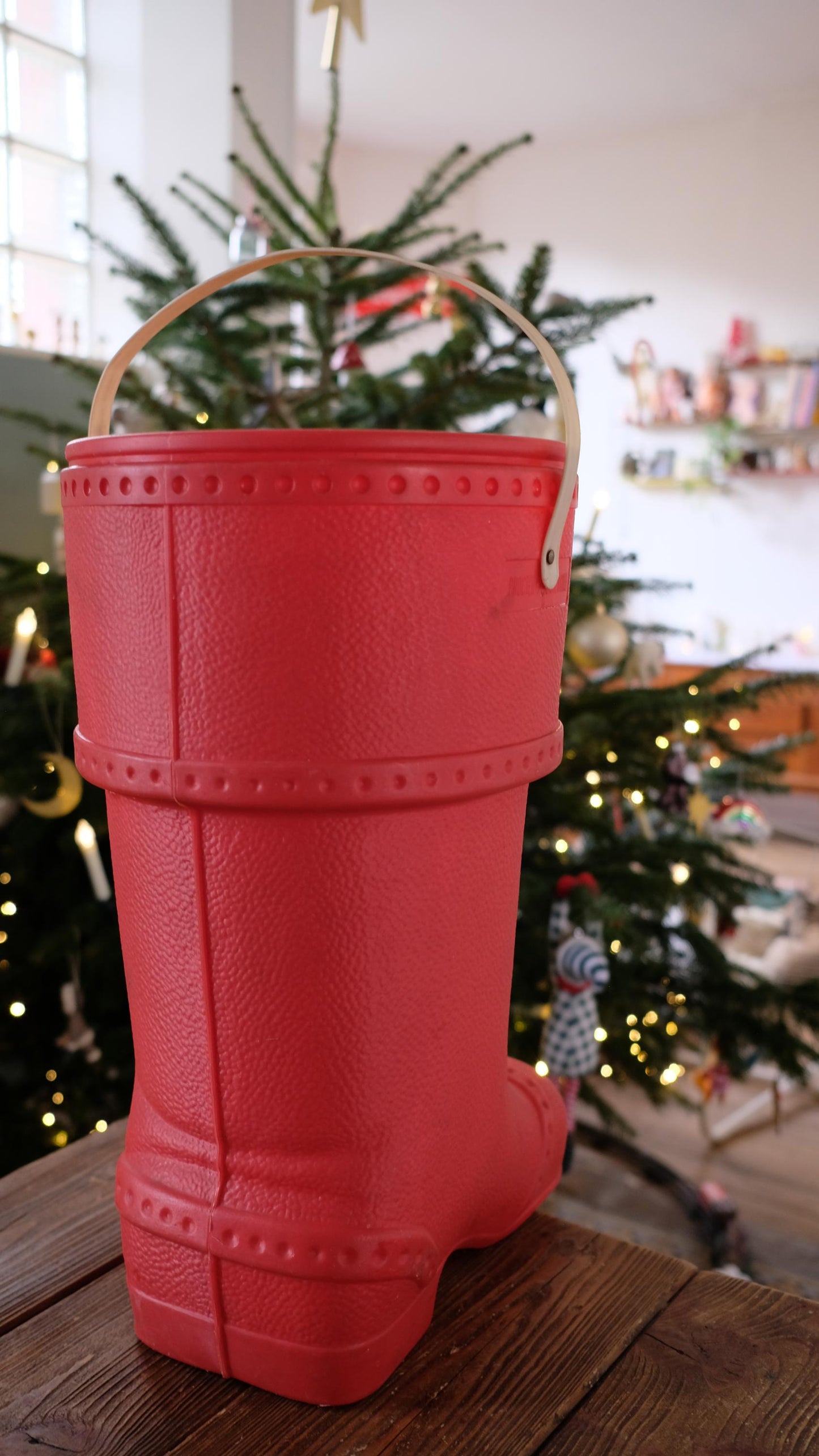 Baril de lessive en forme de botte du père noël