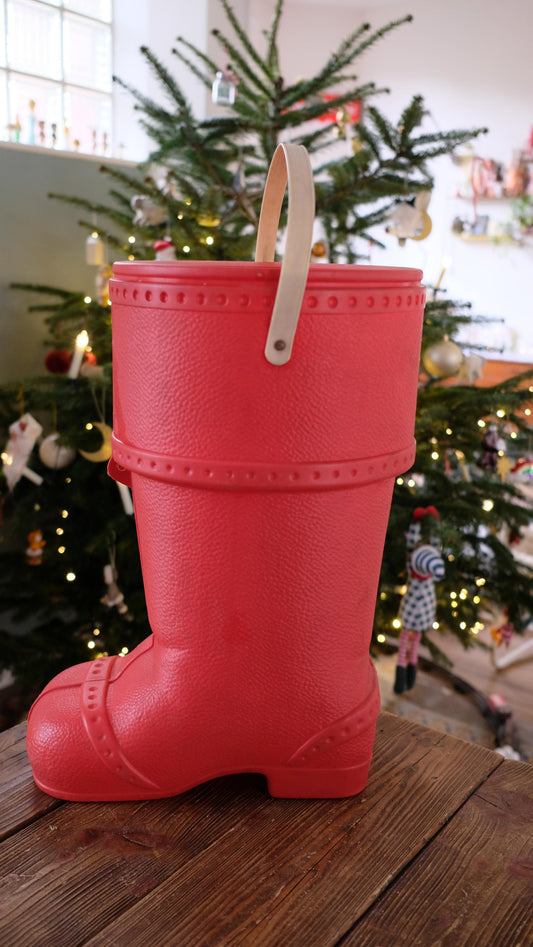 Baril de lessive en forme de botte du père noël